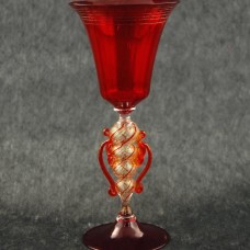 Red goblet with detailed stem, curling wisps